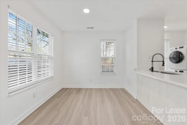 a room with a window and a wooden floor