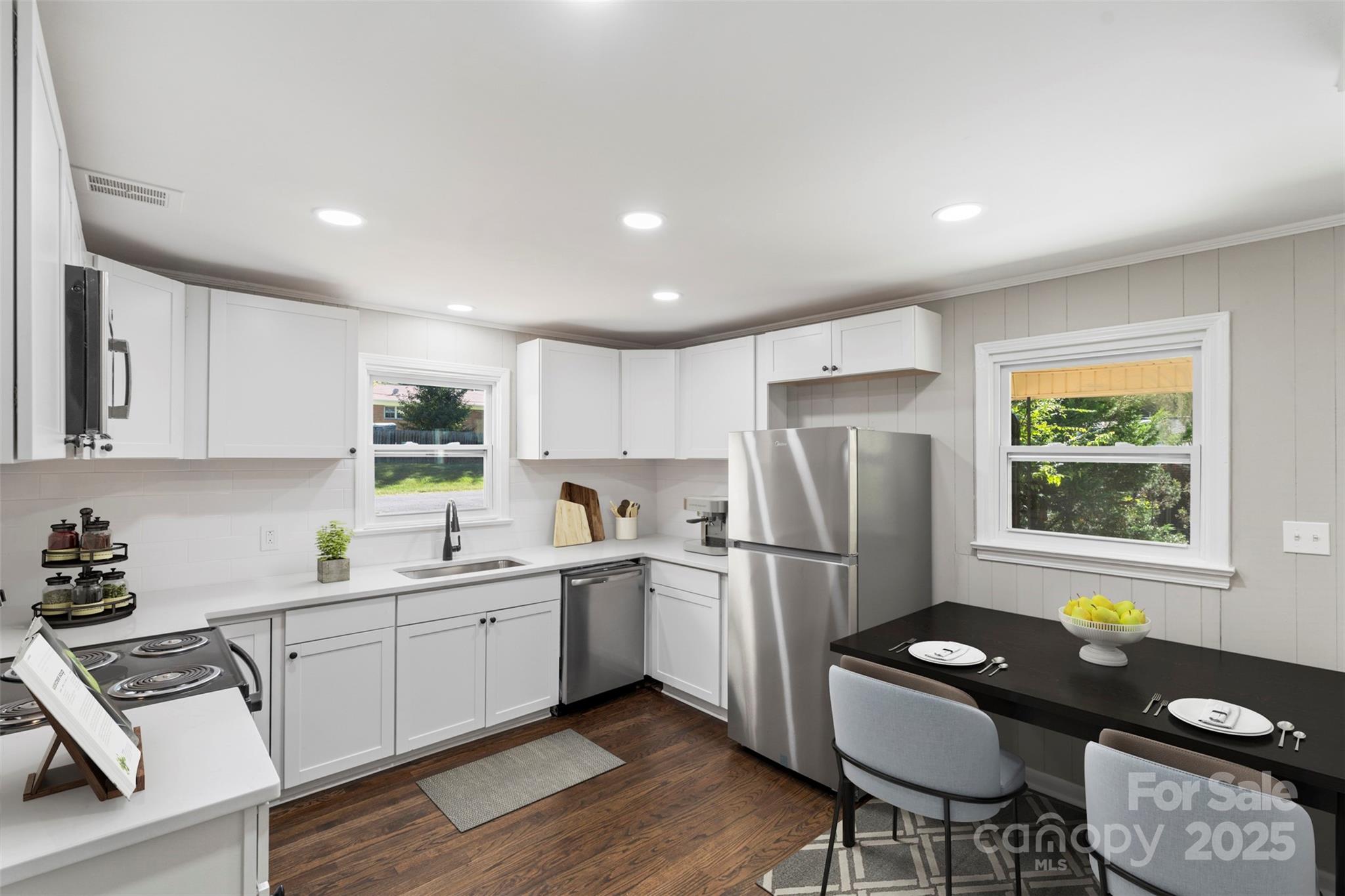 1428 Boxwood Avenue Lancaster, SC 29720 - Photo 16 of 44 a kitchen with stainless steel appliances granite countertop a refrigerator sink and stove
