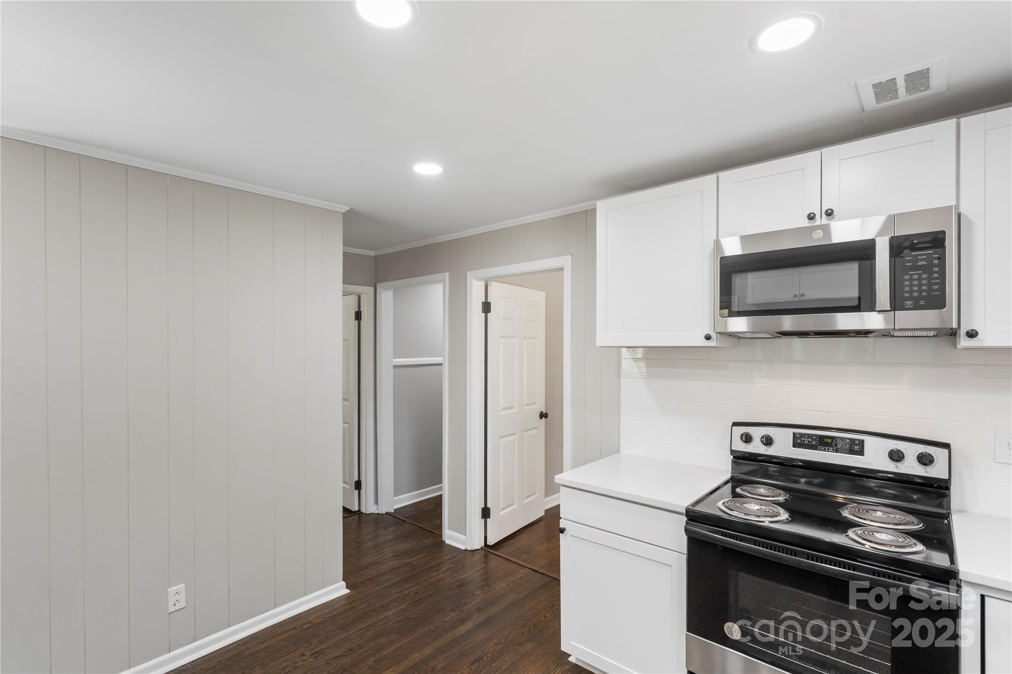 1428 Boxwood Avenue Lancaster, SC 29720 - Photo 20 of 44 a kitchen with a refrigerator and a stove top oven