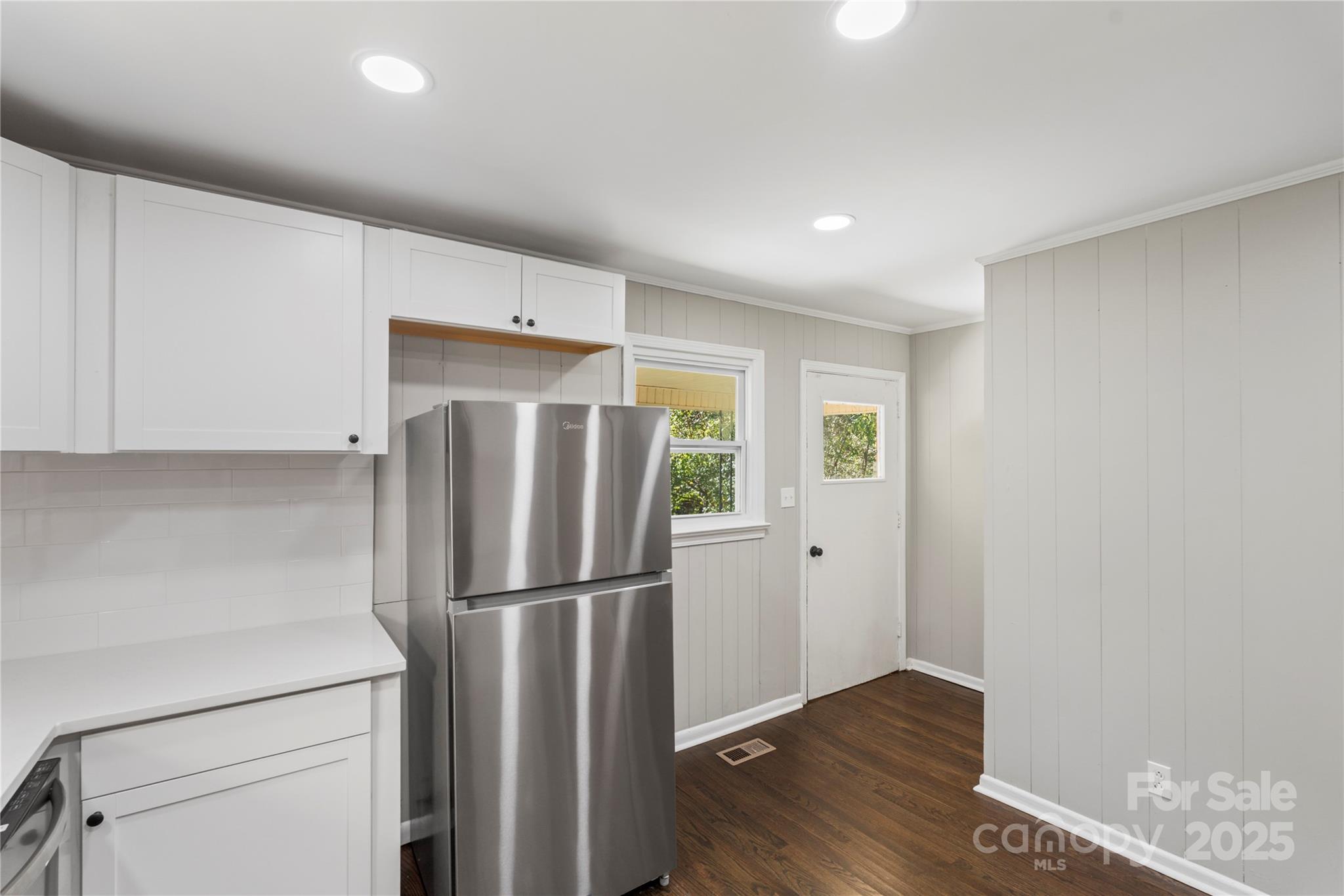1428 Boxwood Avenue Lancaster, SC 29720 - Photo 21 of 44 a kitchen with stainless steel appliances a refrigerator and a cabinets