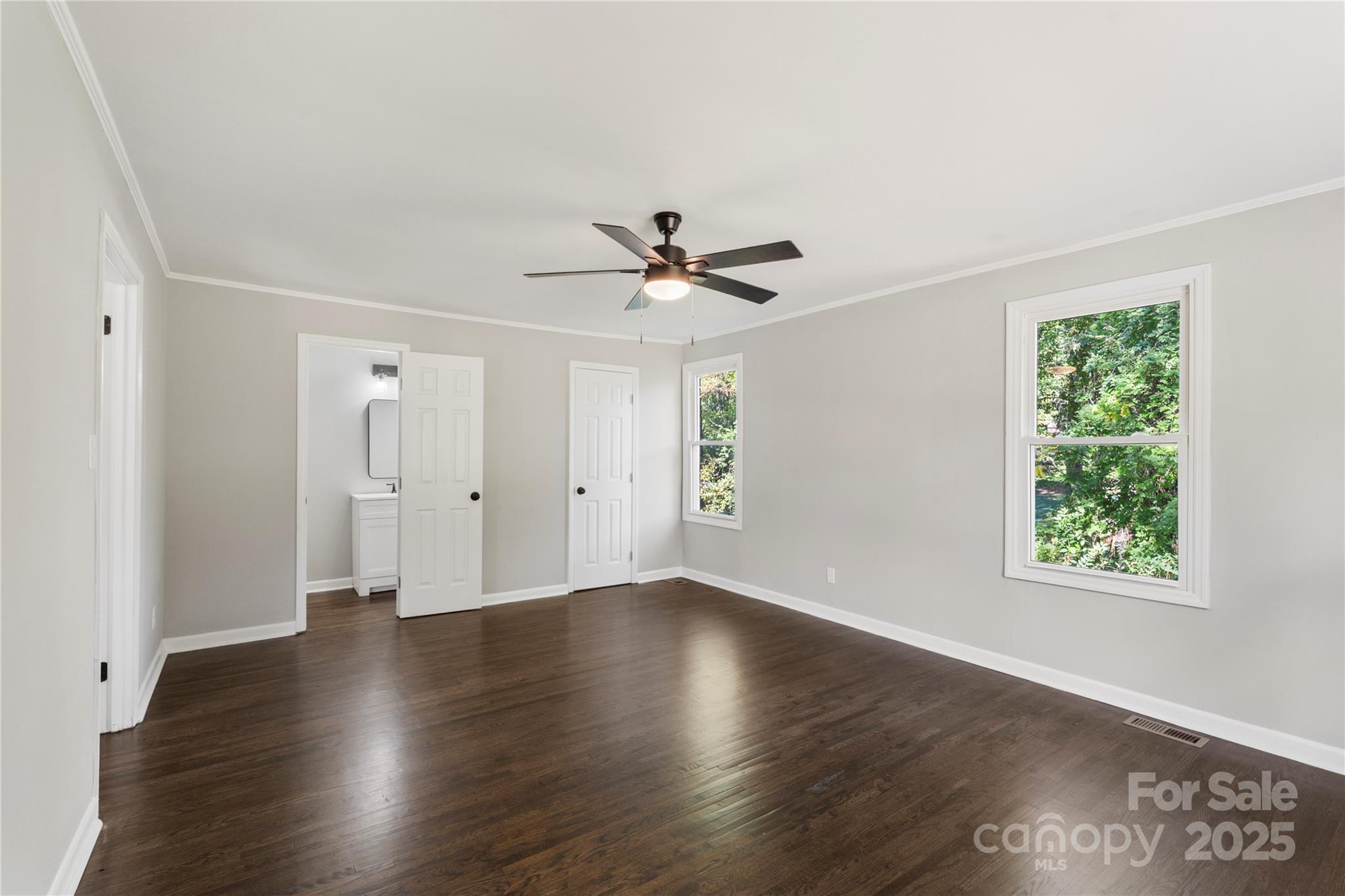 1428 Boxwood Avenue Lancaster, SC 29720 - Photo 24 of 44 an empty room with wooden floor and windows