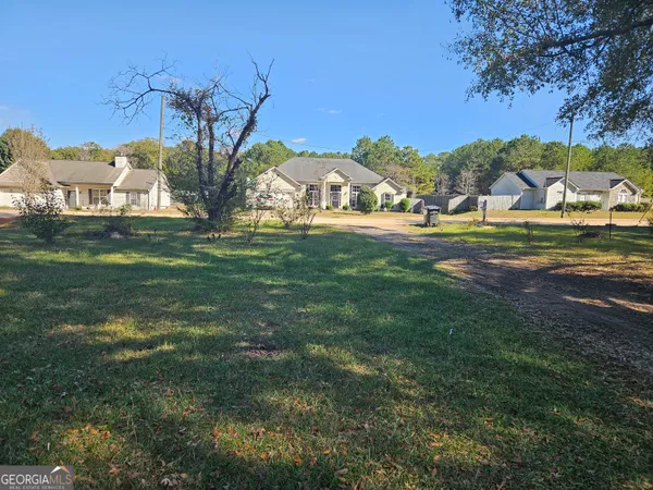 a view of a yard with trees