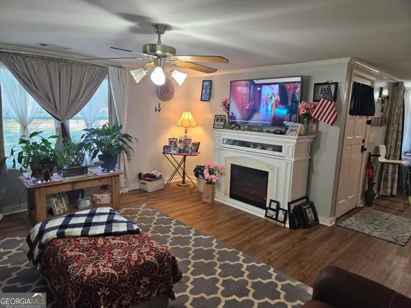a bathroom with a toilet a sink and a window
