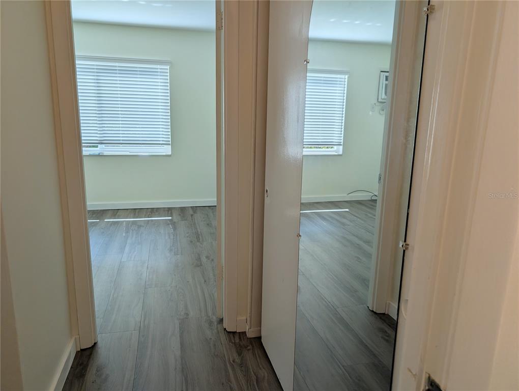 5862 Welcome Road, Unit J25 Bradenton, FL 34207 - Photo 10 of 26 a view of front door with wooden floor