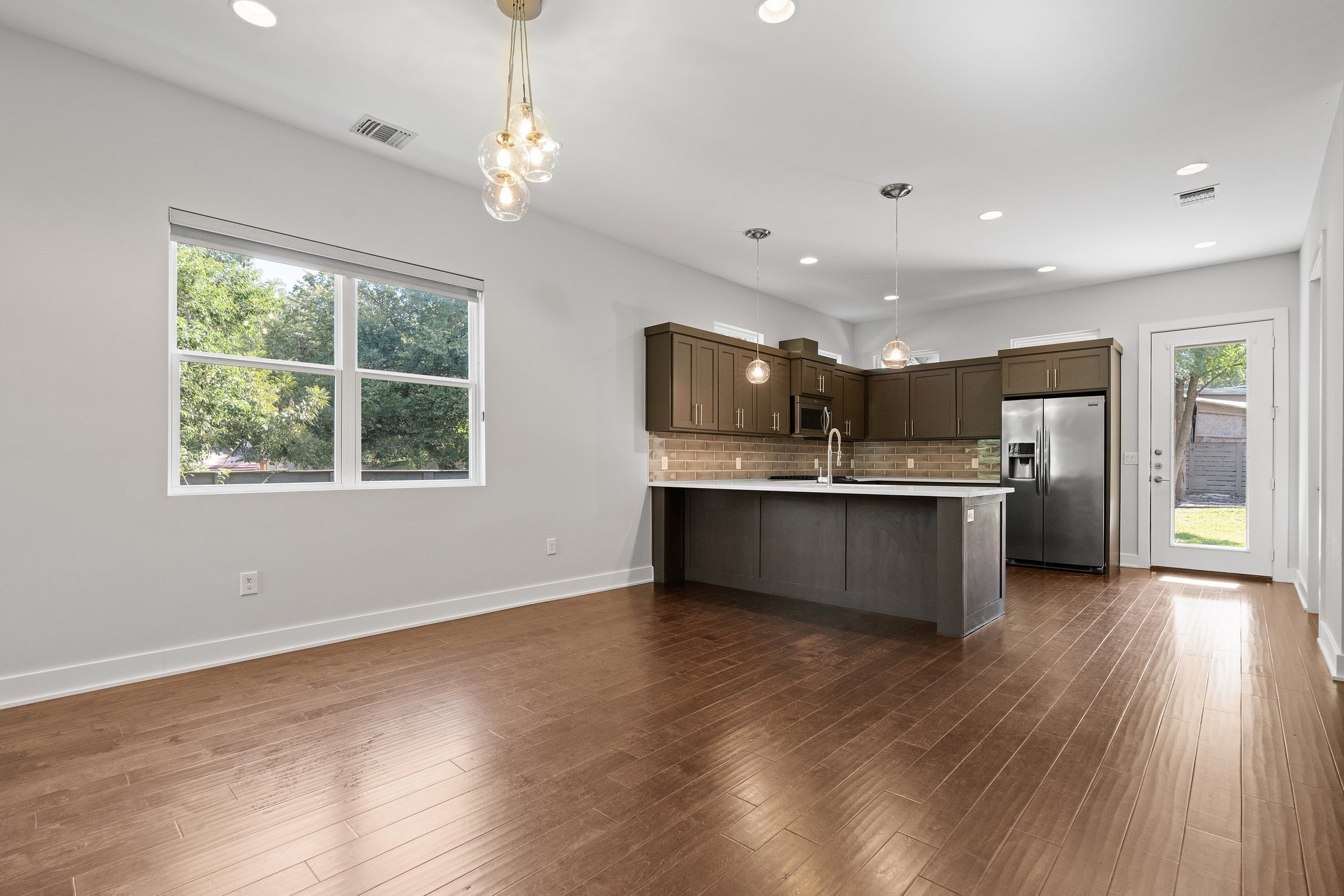 7217 Blessing Avenue, Unit A Austin, TX 78752 - Photo 6 of 22 Freshly Painted Walls in a contemporary soft white color & real wood hardwood flooring.