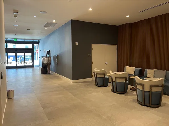 a living room with furniture and window