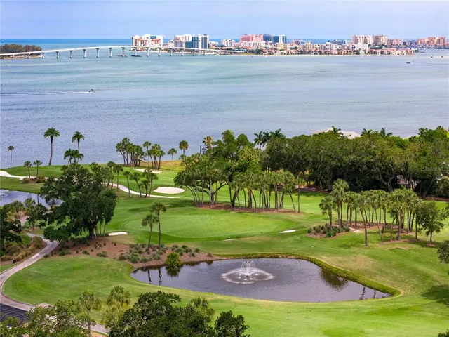 a view of a golf course with a lake