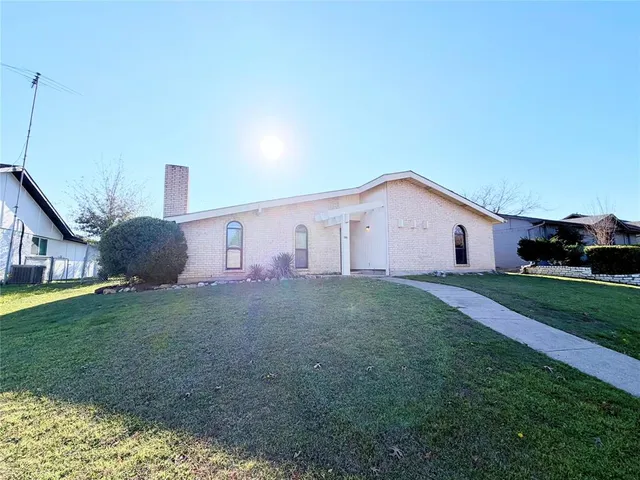 a view of a backyard with potted plants
