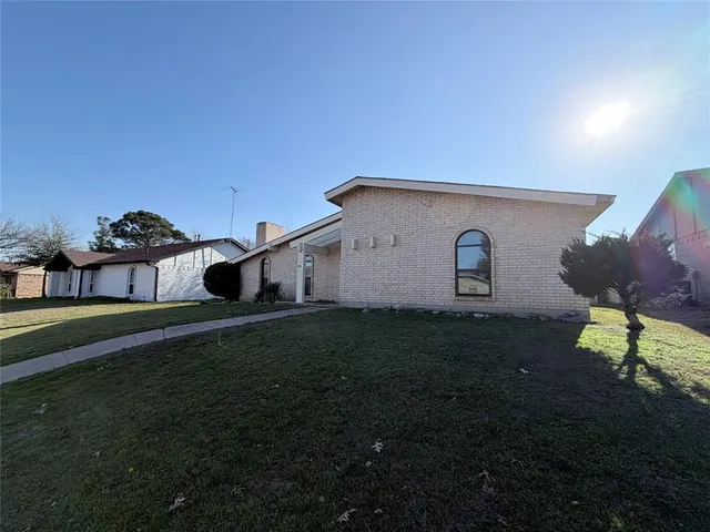 a house view with a garden space