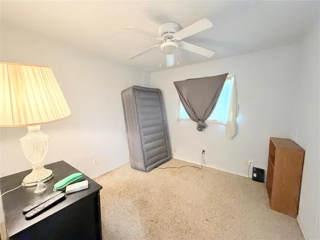 a view of a room with a window and cabinet