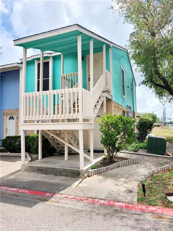 a view of house with outdoor space and parking space