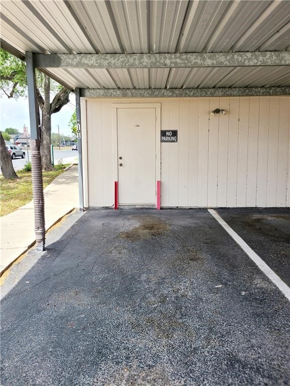 6702 Everhart Road Corpus Christi, TX 78413 - Photo 12 of 14 a view of empty room with wooden floor and fan