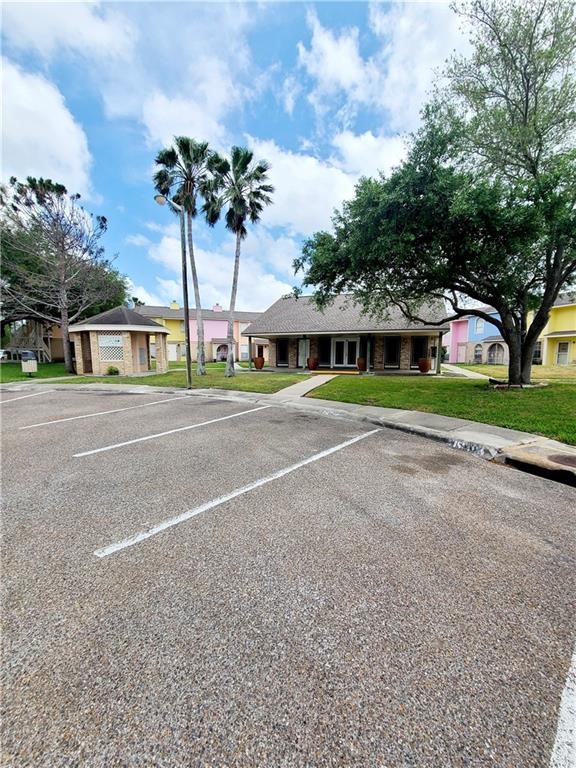 6702 Everhart Road Corpus Christi, TX 78413 - Photo 14 of 14 a view of a house with a yard and potted plants