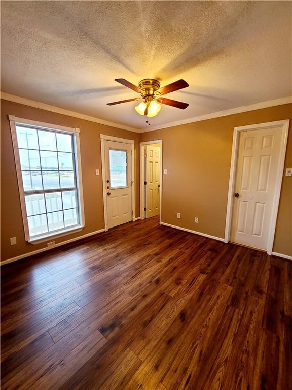 6702 Everhart Road Corpus Christi, TX 78413 - Photo 6 of 14 an empty room with wooden floor and windows