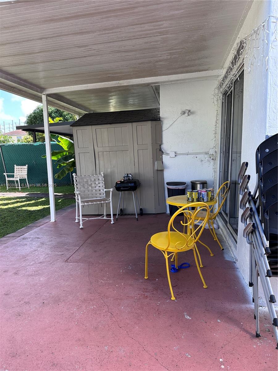 16215 Southwest 139th Court Miami, FL 33177 - Photo 14 of 31 a view of a room with table and chairs