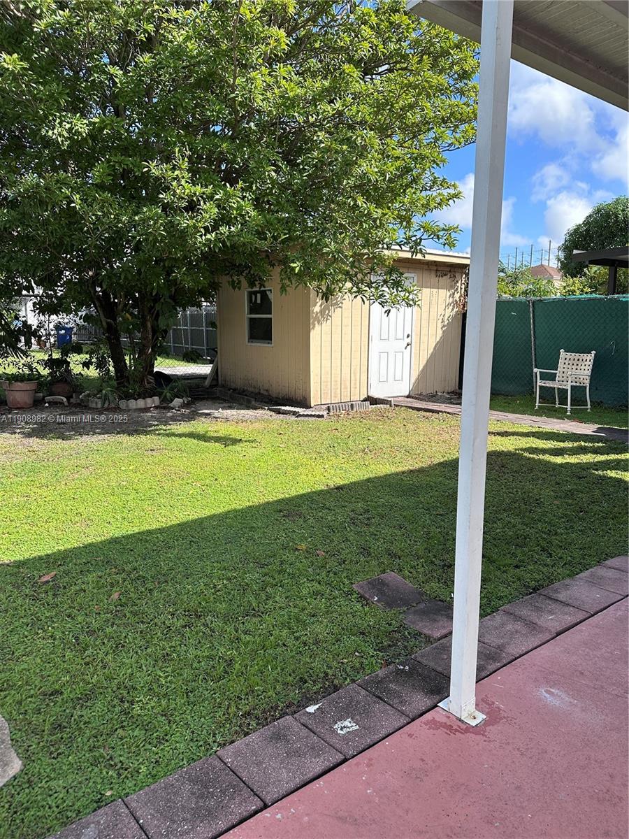 16215 Southwest 139th Court Miami, FL 33177 - Photo 15 of 31 a view of a house with a yard patio and a patio
