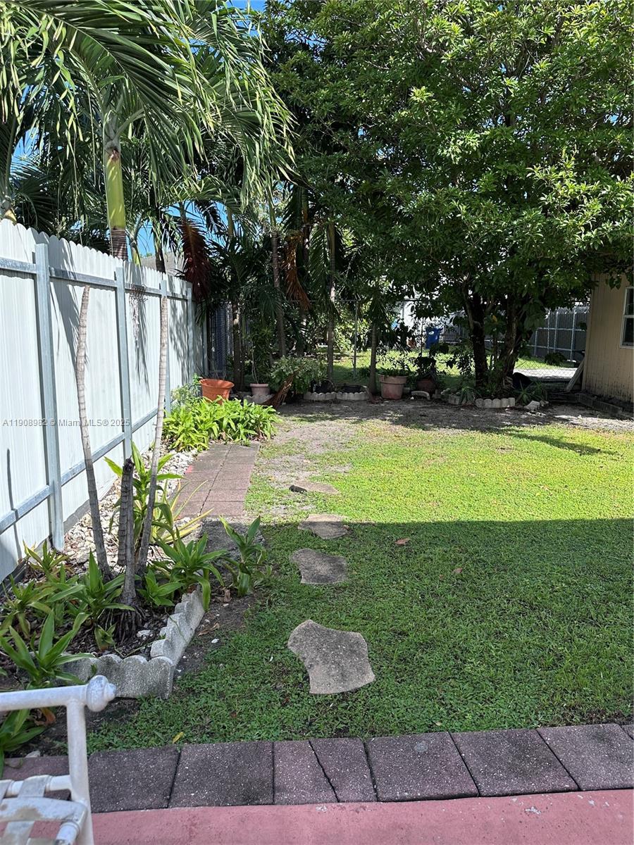 16215 Southwest 139th Court Miami, FL 33177 - Photo 17 of 31 a view of a swimming pool with a yard