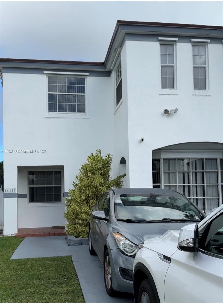 16215 Southwest 139th Court Miami, FL 33177 - Photo 2 of 31 a front view of a house with a yard