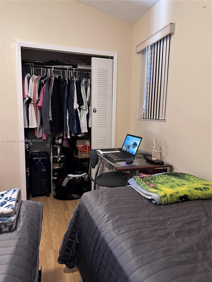 16215 Southwest 139th Court Miami, FL 33177 - Photo 25 of 31 a bed room with two bed and a chair