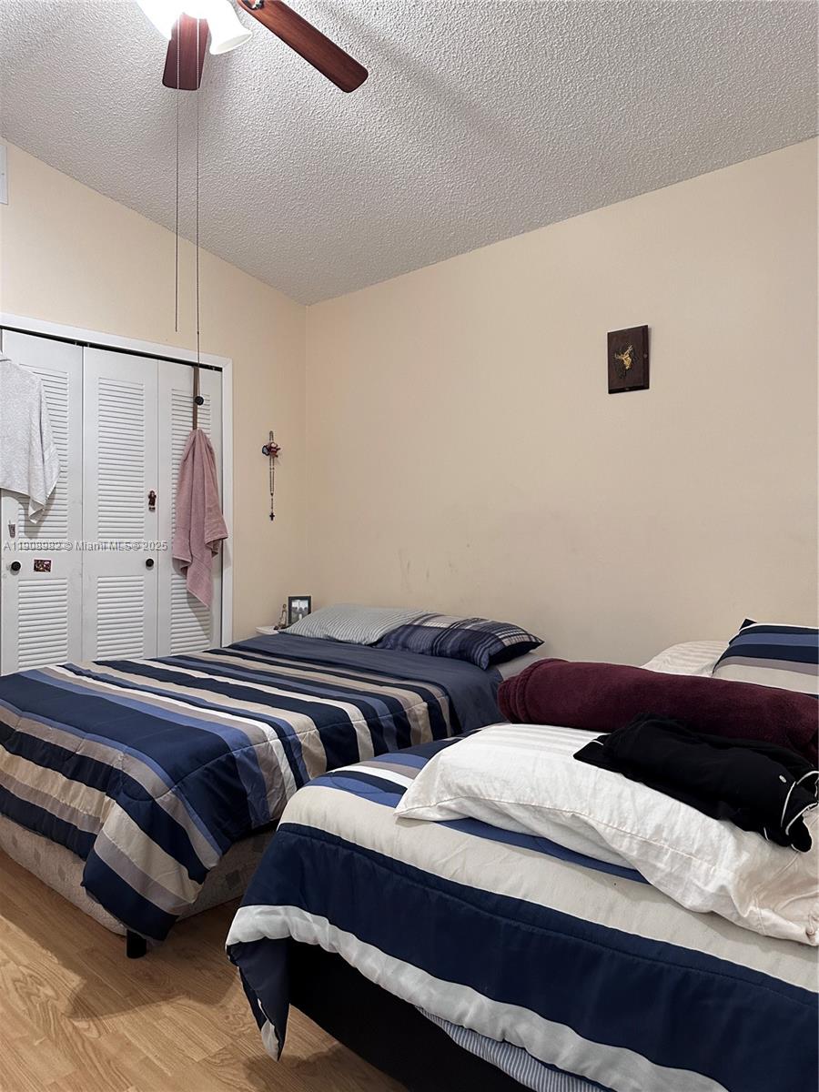 16215 Southwest 139th Court Miami, FL 33177 - Photo 26 of 31 a bedroom with bed and balcony