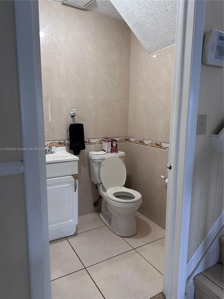 16215 Southwest 139th Court Miami, FL 33177 - Photo 27 of 31 a white toilet sitting next to a bathroom sink