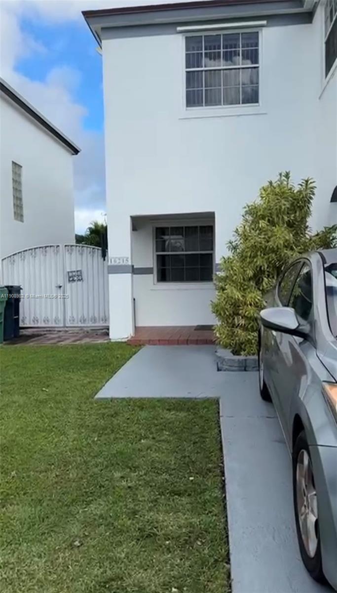 16215 Southwest 139th Court Miami, FL 33177 - Photo 3 of 31 a view of a backyard with a car parked in it