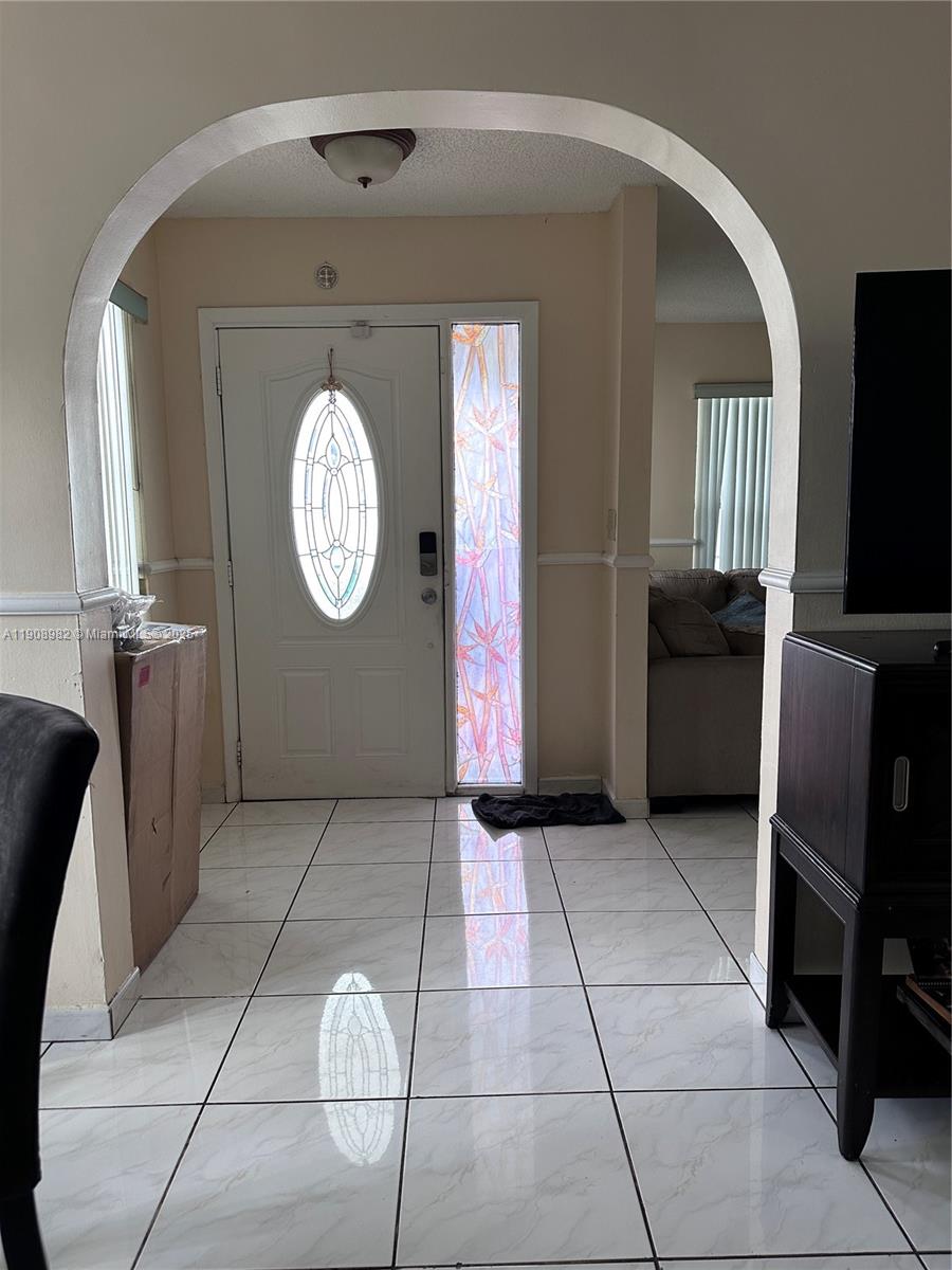 16215 Southwest 139th Court Miami, FL 33177 - Photo 4 of 31 a view of a livingroom with furniture and a window