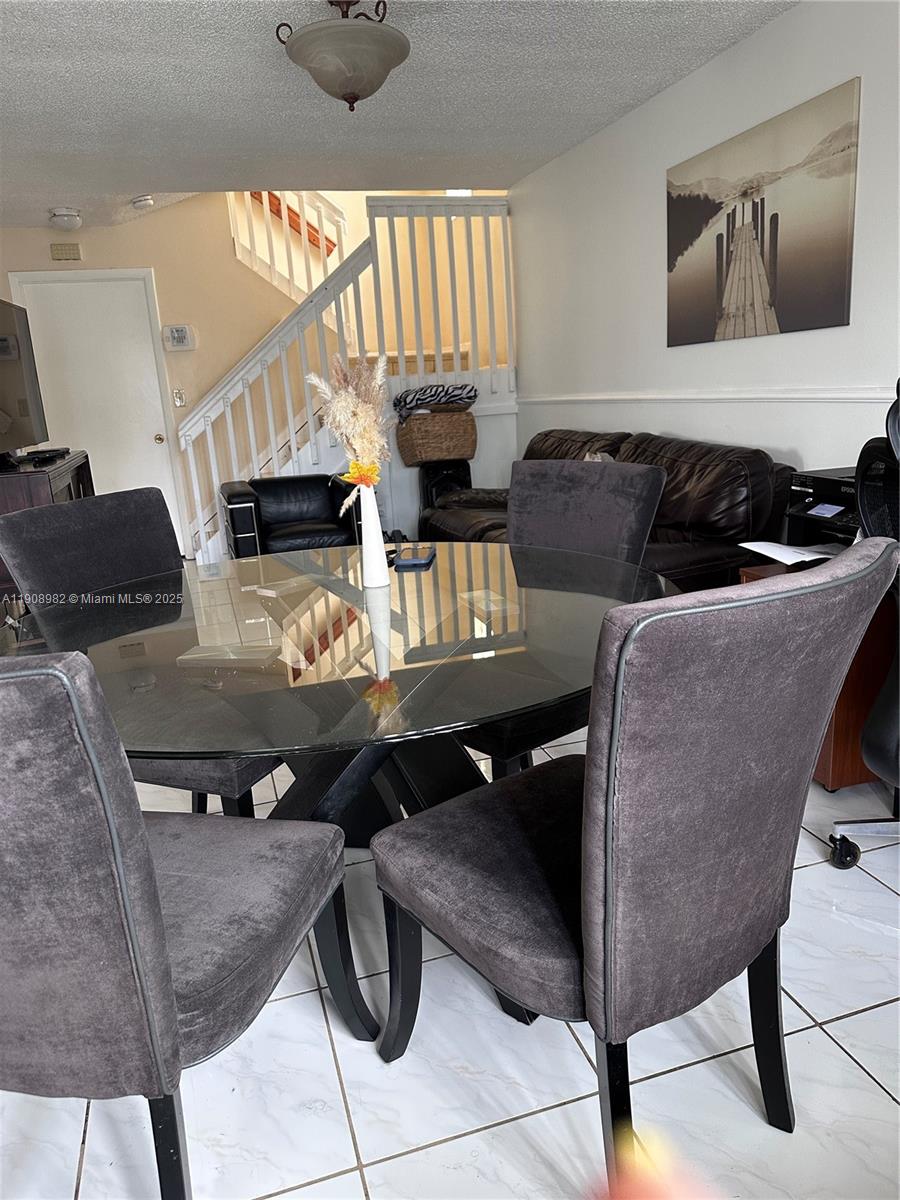 16215 Southwest 139th Court Miami, FL 33177 - Photo 6 of 31 a living room with furniture and a flat screen tv