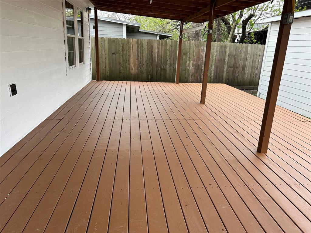 a view of outdoor space with wooden floor