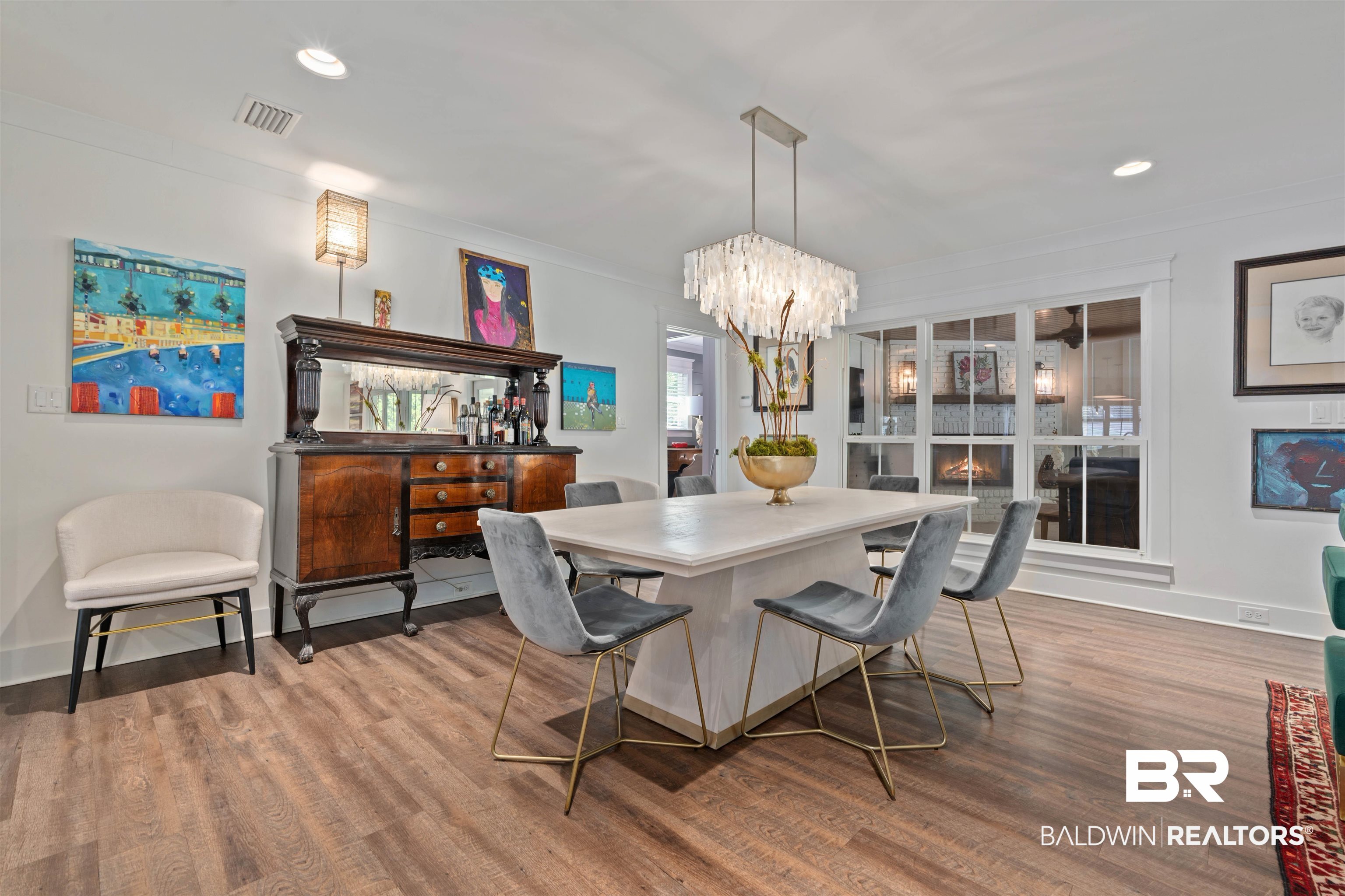 3808 Claridge Road North Mobile, AL 36608 - Photo 17 of 43 Dining area featuring wood-type flooring and a notable chandelier