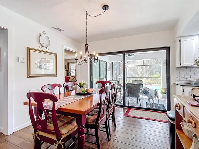 a view of a livingroom with furniture and wooden floor