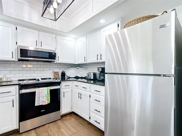 a workspace with furniture and wooden floor