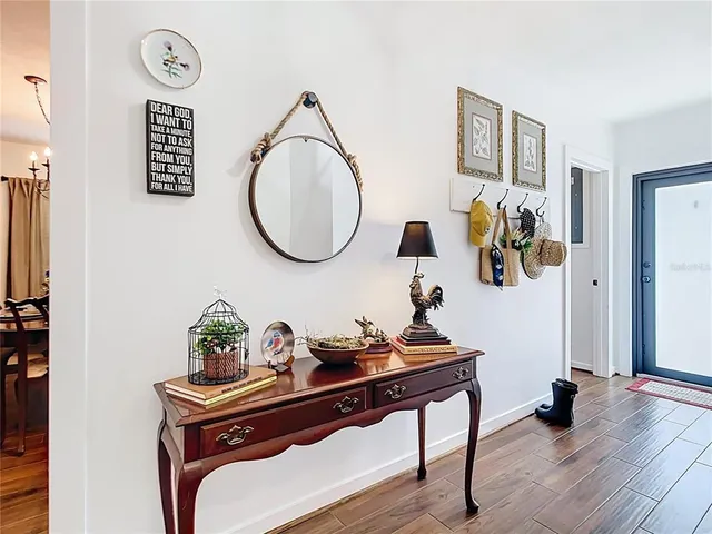 a bathroom with a sink vanity mirror and toilet