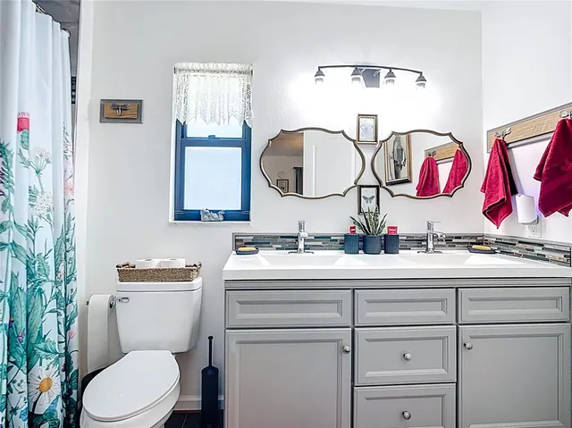 a view of a backyard with swimming pool