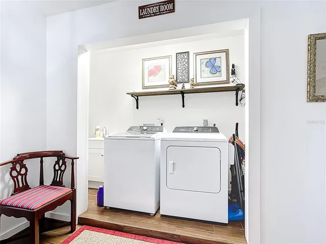 a backyard of a house with table and chairs