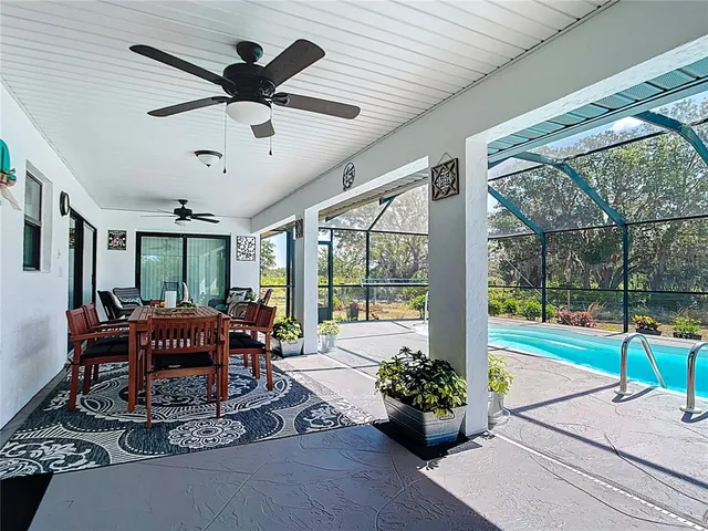 a view of a swimming pool with a yard