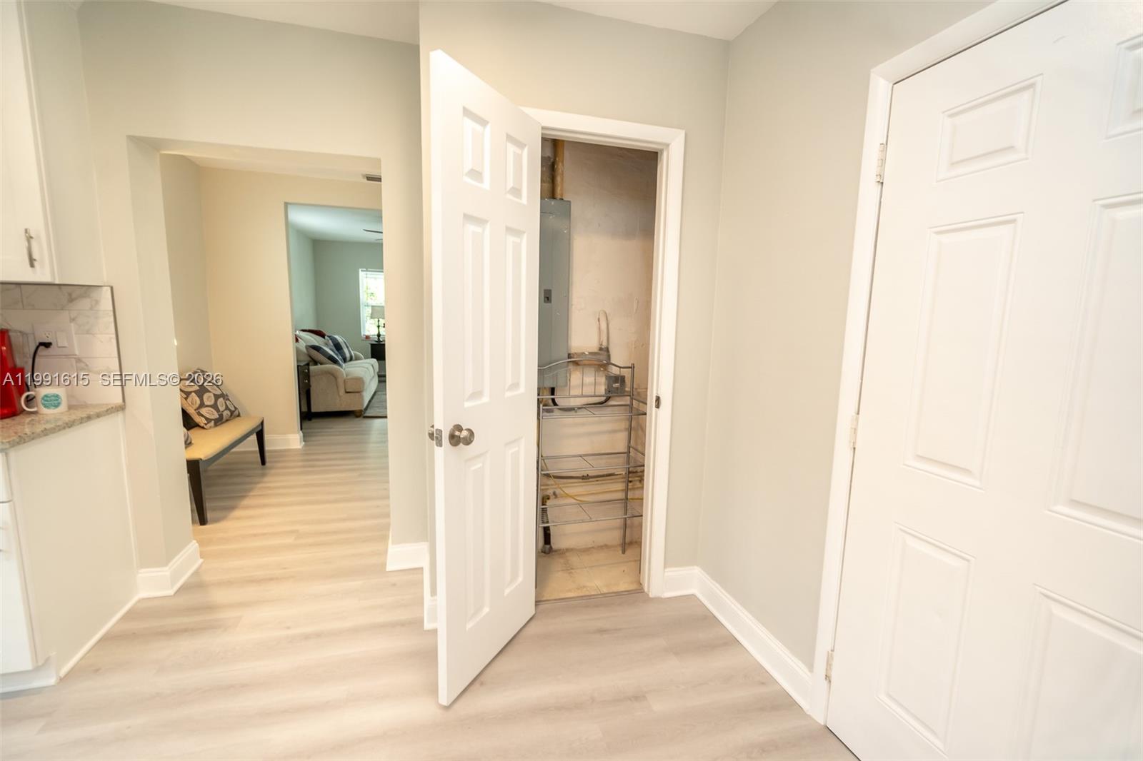 2230 Southwest 60th Court Miami, FL 33155 - Photo 12 of 35 a view of a bathroom from a hallway