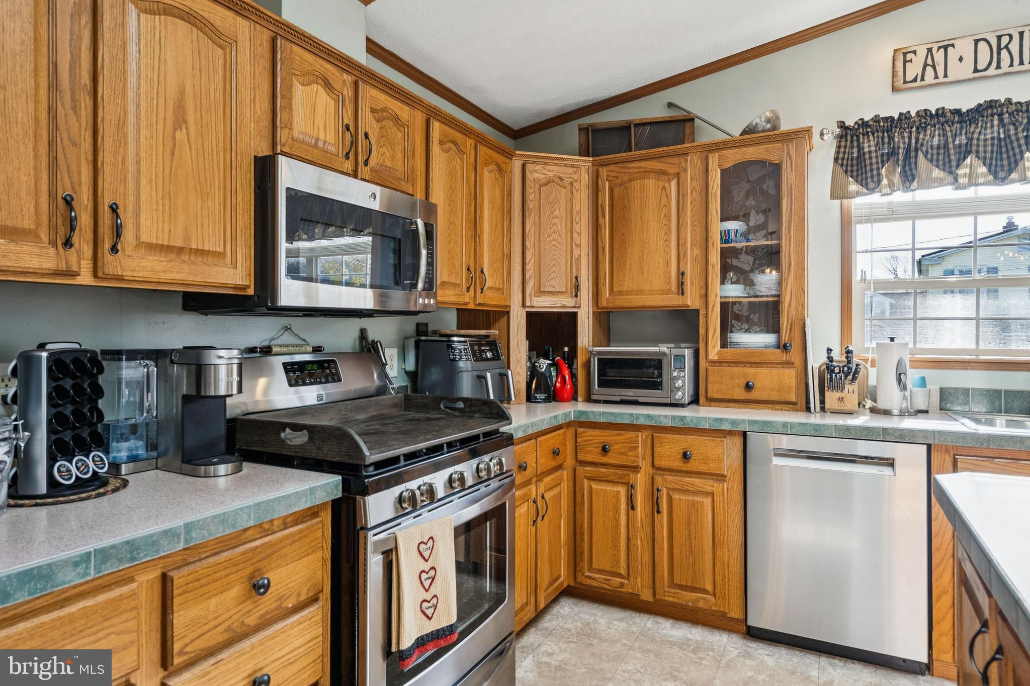 133 Spring Garden Street Woodstown, NJ 08098 - Photo 13 of 50 a kitchen with stainless steel appliances granite countertop a stove and a microwave