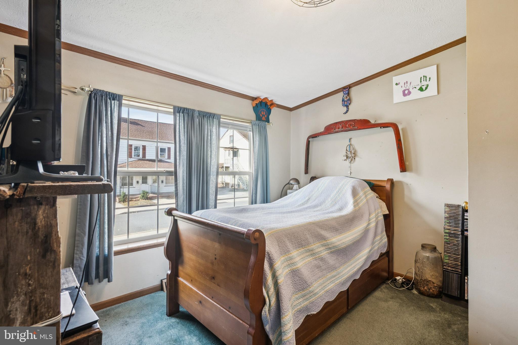 133 Spring Garden Street Woodstown, NJ 08098 - Photo 19 of 50 a bedroom with a bed and large windows