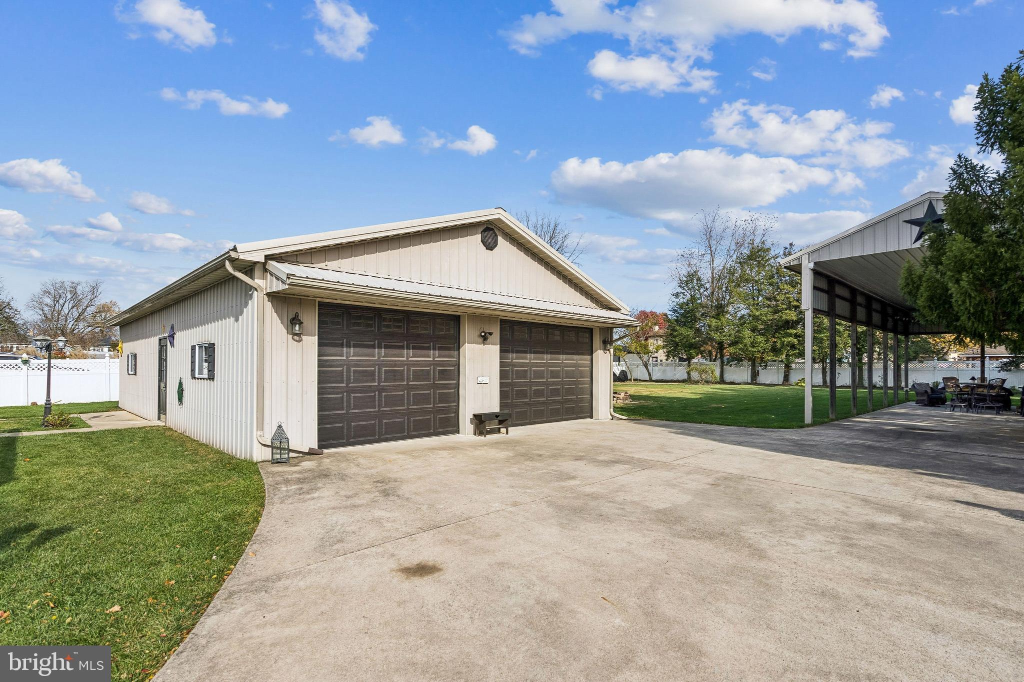 133 Spring Garden Street Woodstown, NJ 08098 - Photo 35 of 50 a front view of a house with a yard and garage