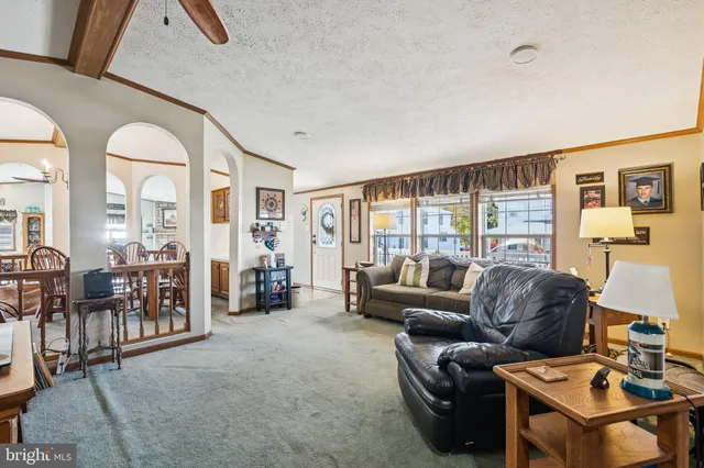 a view of a dining room with furniture chandelier and wooden floor