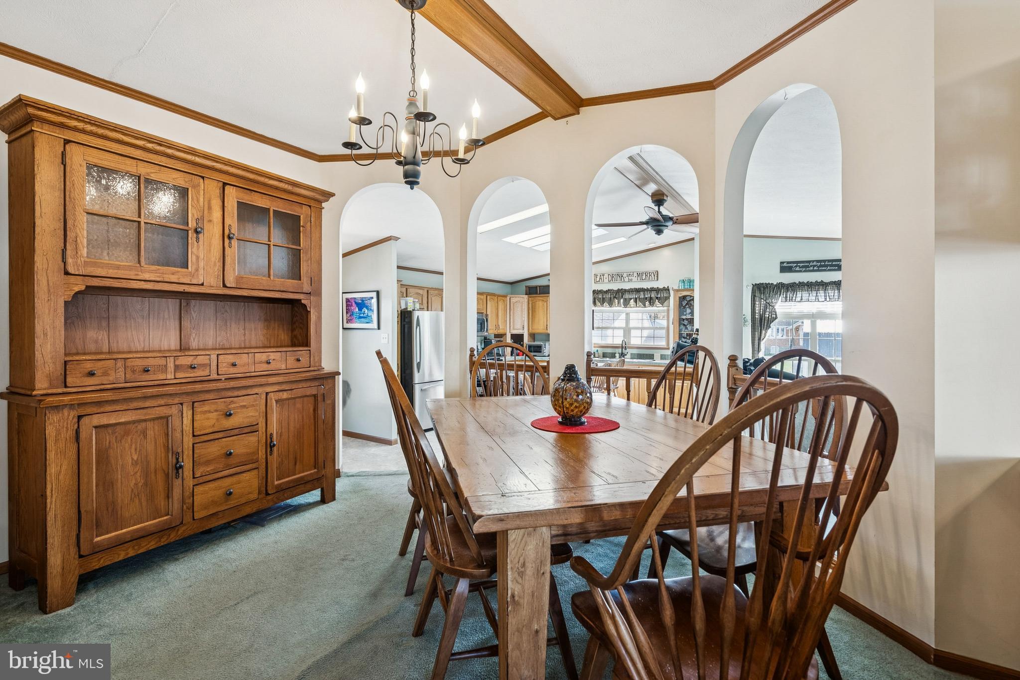 133 Spring Garden Street Woodstown, NJ 08098 - Photo 9 of 50 a view of a dining room with furniture chandelier and wooden floor
