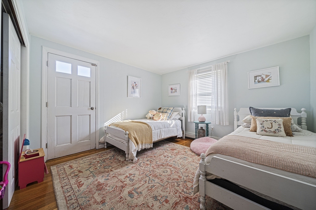 417 Hatherly Road Scituate, MA 02066 - Photo 11 of 25 a bedroom with two beds and painted walls