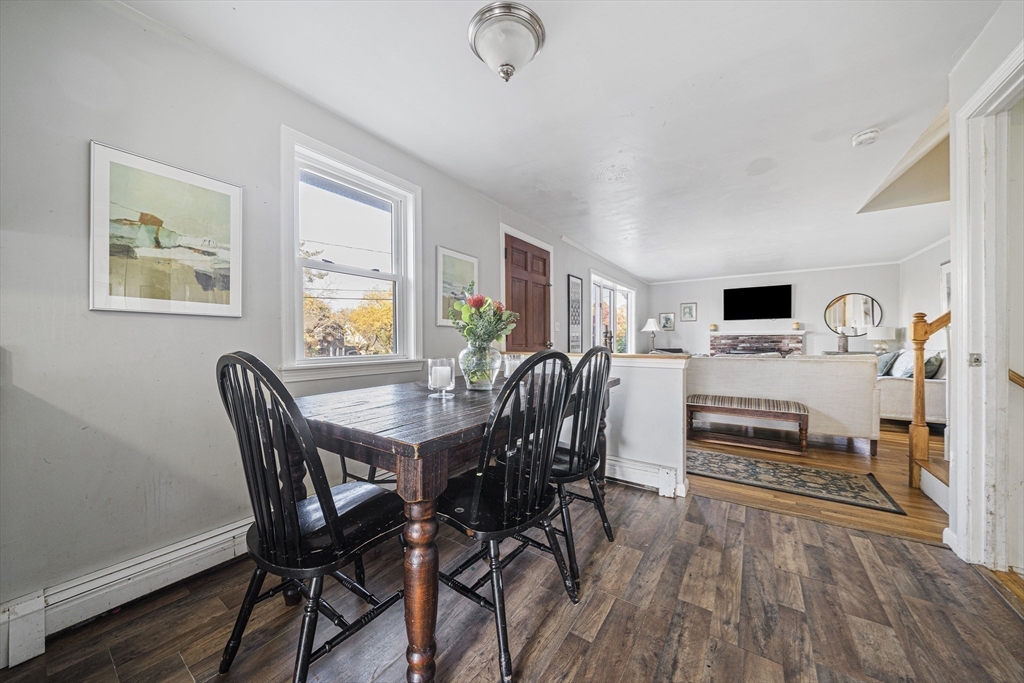 417 Hatherly Road Scituate, MA 02066 - Photo 15 of 25 a view of a dining room with furniture window and wooden floor