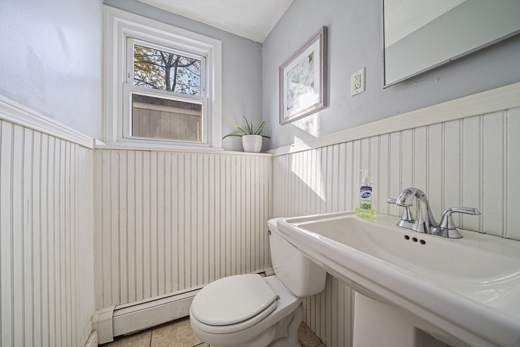 417 Hatherly Road Scituate, MA 02066 - Photo 17 of 25 a bathroom with a sink a toilet and mirror
