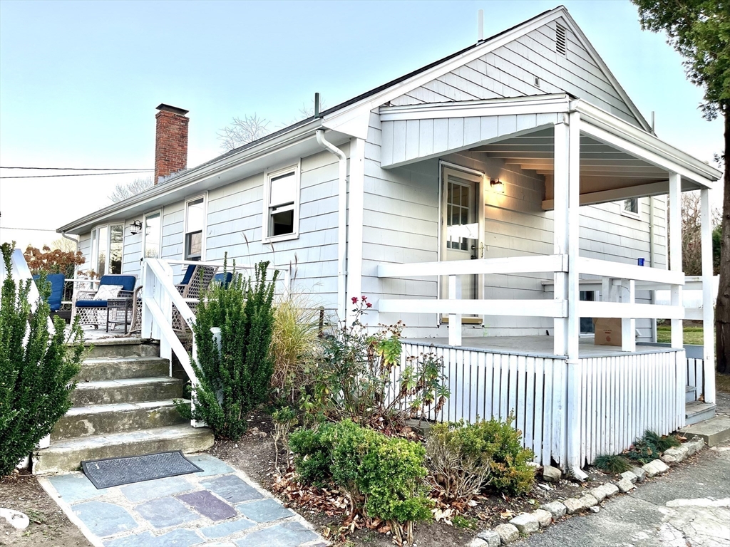 417 Hatherly Road Scituate, MA 02066 - Photo 5 of 25 a front view of a house with plants