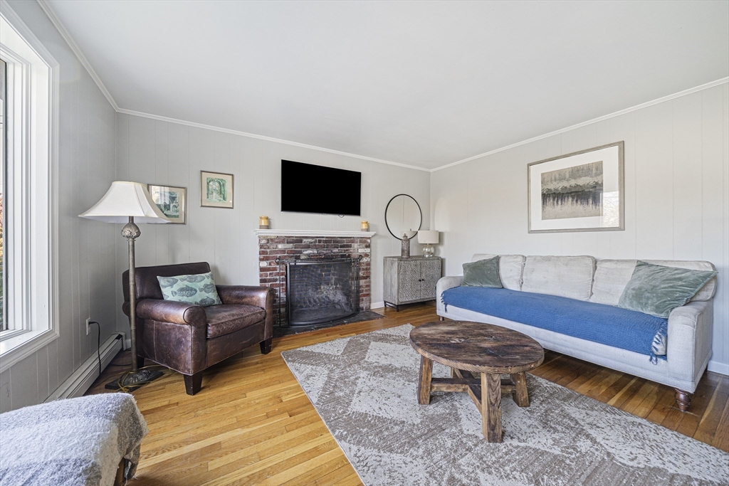 417 Hatherly Road Scituate, MA 02066 - Photo 6 of 25 a living room with furniture and a flat screen tv