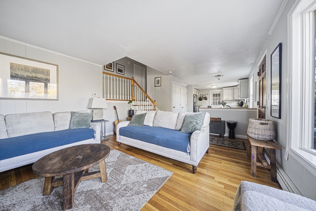 417 Hatherly Road Scituate, MA 02066 - Photo 8 of 25 a living room with furniture and a wooden floor