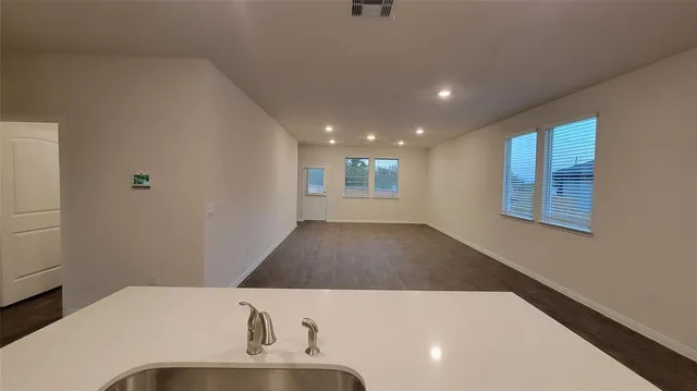 a view of a backyard with grass