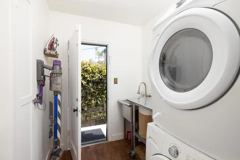 a close view of a utility room with dryer and washer